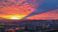 mount rainier morning shadow on thin cloud layer